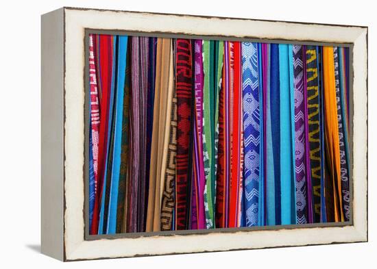 Cloths, Blankets, Scarves, and Hammocks Hang on Display at the Otavalo Market, in Otavalo, Ecuador-Karine Aigner-Framed Premier Image Canvas