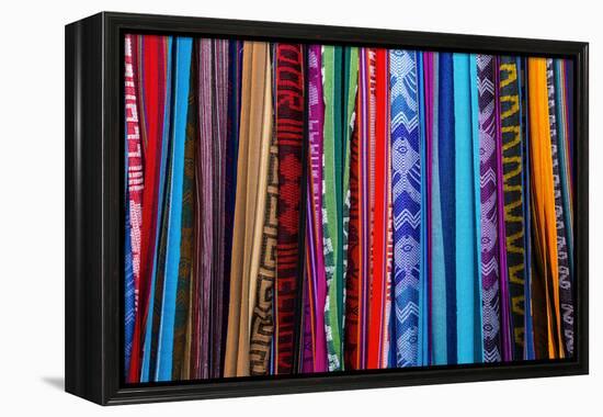 Cloths, Blankets, Scarves, and Hammocks Hang on Display at the Otavalo Market, in Otavalo, Ecuador-Karine Aigner-Framed Premier Image Canvas