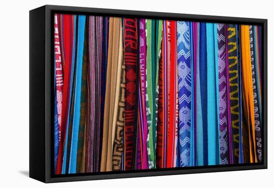 Cloths, Blankets, Scarves, and Hammocks Hang on Display at the Otavalo Market, in Otavalo, Ecuador-Karine Aigner-Framed Premier Image Canvas