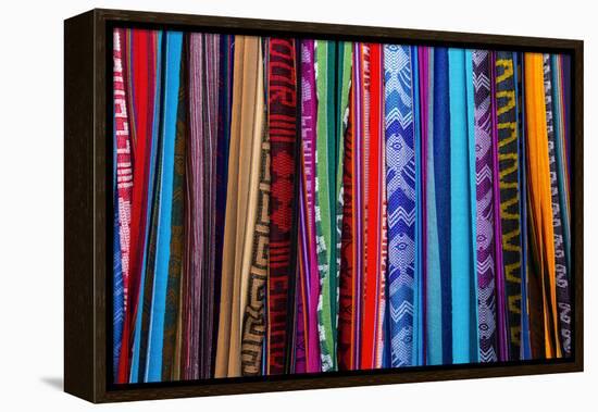 Cloths, Blankets, Scarves, and Hammocks Hang on Display at the Otavalo Market, in Otavalo, Ecuador-Karine Aigner-Framed Premier Image Canvas