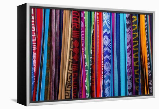 Cloths, Blankets, Scarves, and Hammocks Hang on Display at the Otavalo Market, in Otavalo, Ecuador-Karine Aigner-Framed Premier Image Canvas