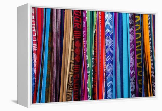 Cloths, Blankets, Scarves, and Hammocks Hang on Display at the Otavalo Market, in Otavalo, Ecuador-Karine Aigner-Framed Premier Image Canvas