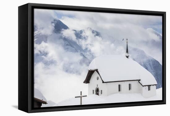Clouds Above the Mountain Huts and Church Covered with Snow, Bettmeralp, District of Raron-Roberto Moiola-Framed Premier Image Canvas