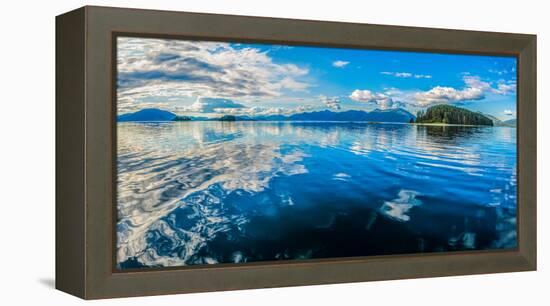 Clouds and sky reflected in the calm waters of the Inside Passage, Southeast Alaska, USA-Mark A Johnson-Framed Premier Image Canvas