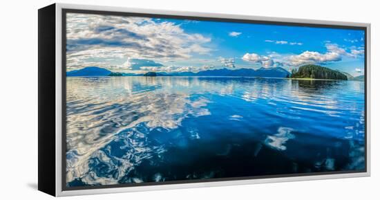 Clouds and sky reflected in the calm waters of the Inside Passage, Southeast Alaska, USA-Mark A Johnson-Framed Premier Image Canvas