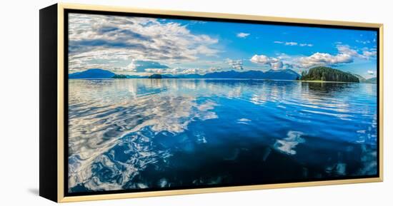 Clouds and sky reflected in the calm waters of the Inside Passage, Southeast Alaska, USA-Mark A Johnson-Framed Premier Image Canvas