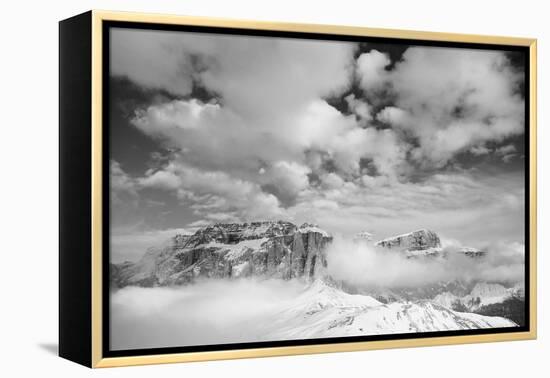 Clouds hang between the mountains of the Dolomites-Jean Schwarz-Framed Premier Image Canvas