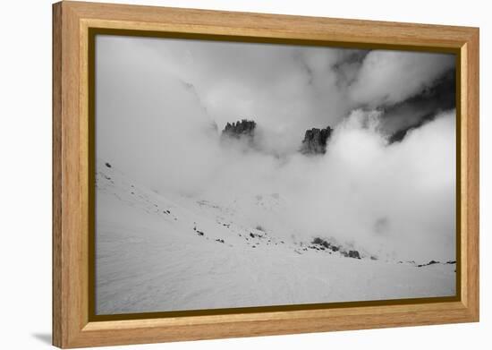 Clouds hang between the mountains of the Dolomites-Jean Schwarz-Framed Premier Image Canvas