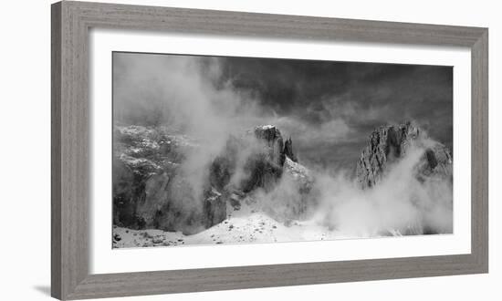 Clouds hang between the mountains of the Dolomites-Jean Schwarz-Framed Photographic Print