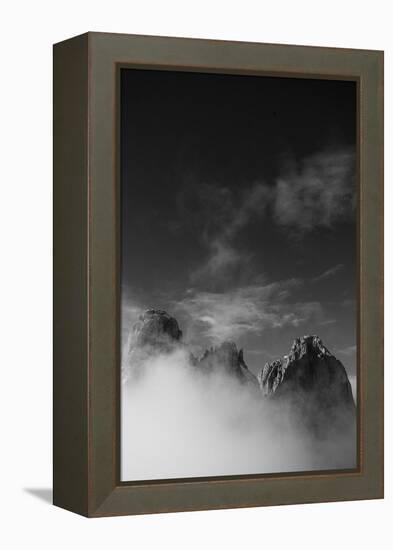 Clouds hang between the mountains of the Dolomites-Jean Schwarz-Framed Premier Image Canvas