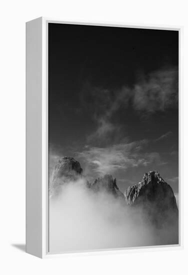 Clouds hang between the mountains of the Dolomites-Jean Schwarz-Framed Premier Image Canvas