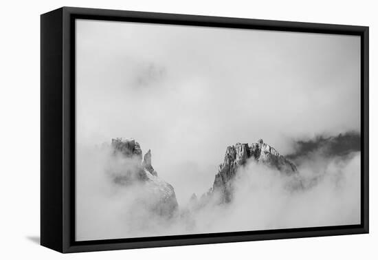 Clouds hang between the mountains of the Dolomites-Jean Schwarz-Framed Premier Image Canvas