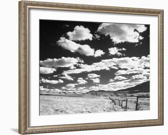 Clouds Hanging in Sky over Grassy Plain-Fritz Goro-Framed Photographic Print