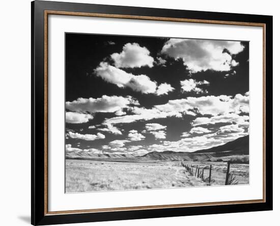 Clouds Hanging in Sky over Grassy Plain-Fritz Goro-Framed Photographic Print