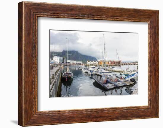 Clouds on rocky peaks frame the boats in the harbor of the fishing village of Svolvaer, Vagan, Lofo-Roberto Moiola-Framed Photographic Print