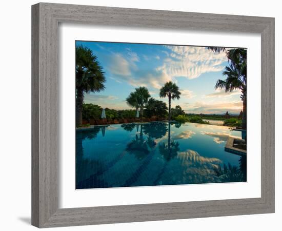 Clouds reflected in the infinity pool at sunrise, Aureum Palace Hotel, Bagan, Mandalay Region, M...-null-Framed Photographic Print