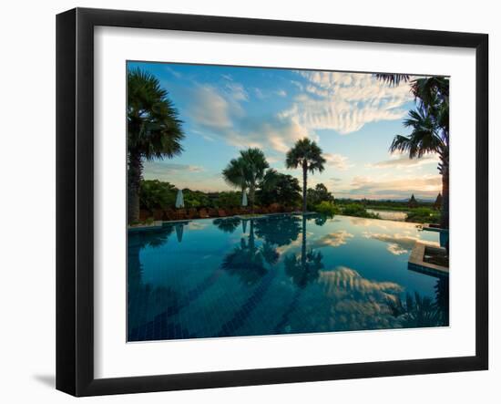 Clouds reflected in the infinity pool at sunrise, Aureum Palace Hotel, Bagan, Mandalay Region, M...-null-Framed Photographic Print