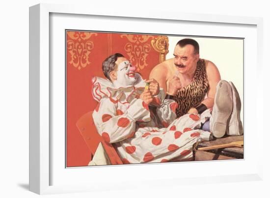 Clown Relaxing with Strongman-null-Framed Art Print