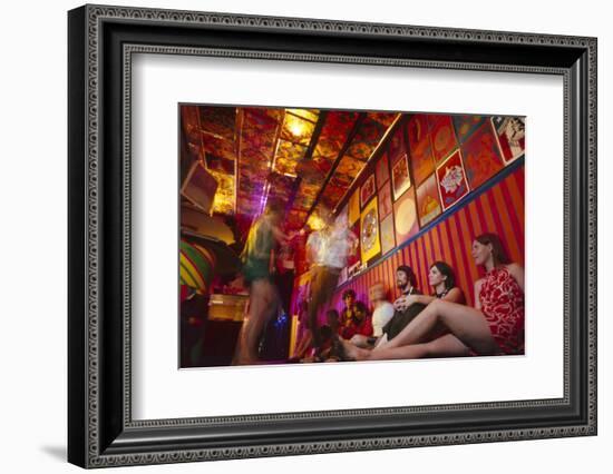 Clubgoers Against a Wall Decorated with Psychedelic Art and Posters, New York, New York, 1967-Yale Joel-Framed Photographic Print