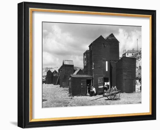 Clustered on the Shingle of the Old Town of Hastings Sussex are These Tall Black Huts-Fred Musto-Framed Photographic Print