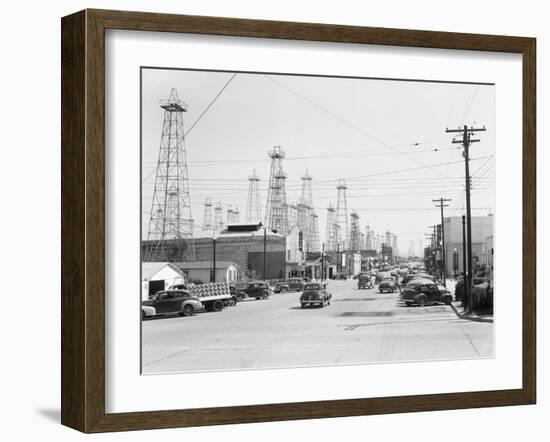 Clusters of Oil Derricks along Street-Philip Gendreau-Framed Photographic Print