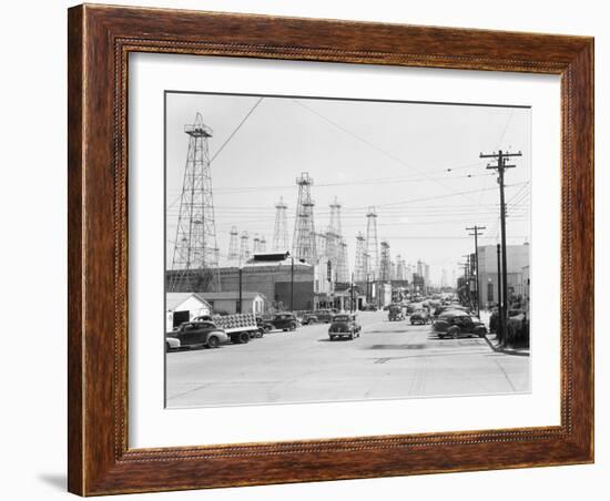 Clusters of Oil Derricks along Street-Philip Gendreau-Framed Photographic Print