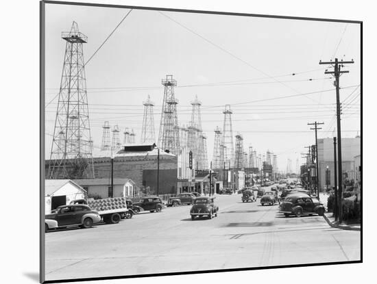 Clusters of Oil Derricks along Street-Philip Gendreau-Mounted Photographic Print