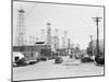 Clusters of Oil Derricks along Street-Philip Gendreau-Mounted Photographic Print