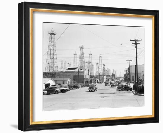 Clusters of Oil Derricks along Street-Philip Gendreau-Framed Photographic Print