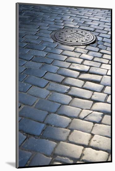 Cobbled Street, Manhole Cover in Old Town, Prague, Czech Republic, Europe-Martin Child-Mounted Photographic Print