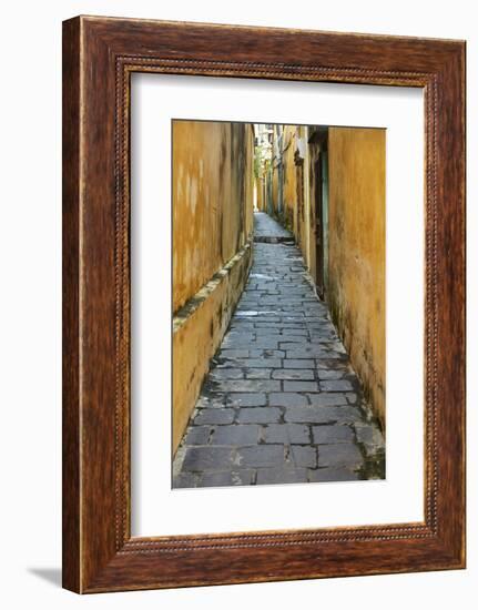 Cobblestones and yellow walls in alleyway, Hoi An, Vietnam-David Wall-Framed Photographic Print