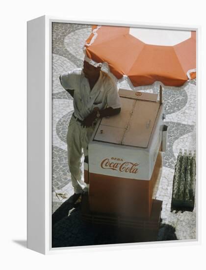 Coca-Cola Vendor Leaning on Cart with Umbrella on Mosaic Sidewalk, Copacabana Beach, Rio de Janeiro-Dmitri Kessel-Framed Premier Image Canvas