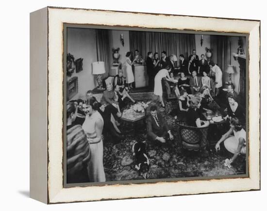 Cocktail Party in the Home of Mrs. R. Craig Montgomery-Yale Joel-Framed Premier Image Canvas