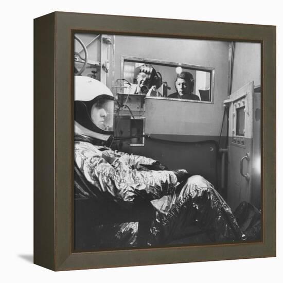 Col. John P. Stapp Watching a Subject in the Altitude Chamber-null-Framed Premier Image Canvas