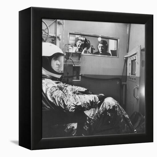 Col. John P. Stapp Watching a Subject in the Altitude Chamber-null-Framed Premier Image Canvas