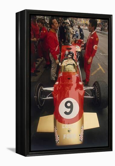 Colin Chapman and a Mechanic in Discussion over Graham Hill's Lotus, Monaco Grand Prix, 1969-null-Framed Premier Image Canvas