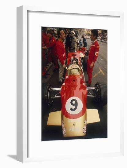 Colin Chapman and a Mechanic in Discussion over Graham Hill's Lotus, Monaco Grand Prix, 1969-null-Framed Photographic Print