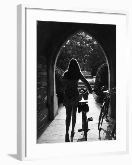 College Co-Ed Walking Bicycle Through an Archway on the Campus of Princeton University-Alfred Eisenstaedt-Framed Photographic Print