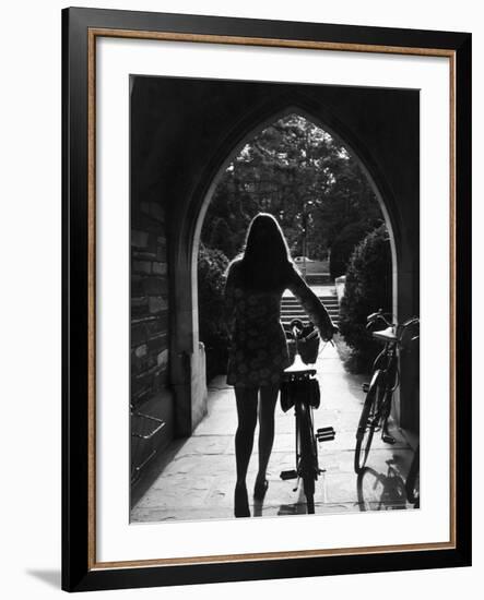 College Co-Ed Walking Bicycle Through an Archway on the Campus of Princeton University-Alfred Eisenstaedt-Framed Photographic Print