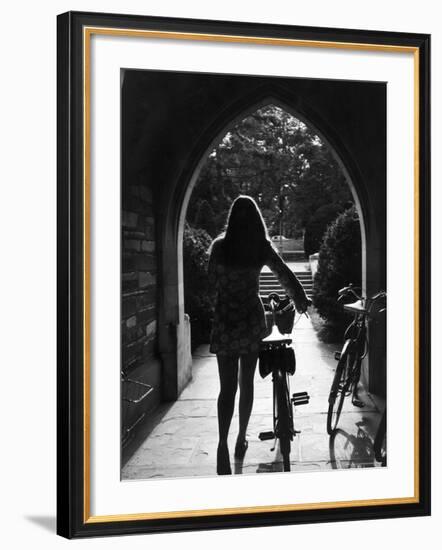 College Co-Ed Walking Bicycle Through an Archway on the Campus of Princeton University-Alfred Eisenstaedt-Framed Photographic Print