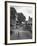 Collie Sheepdog Sitting in Road Leading Up Toward Castle Farm Owned by Beatrix Potter-George Rodger-Framed Photographic Print