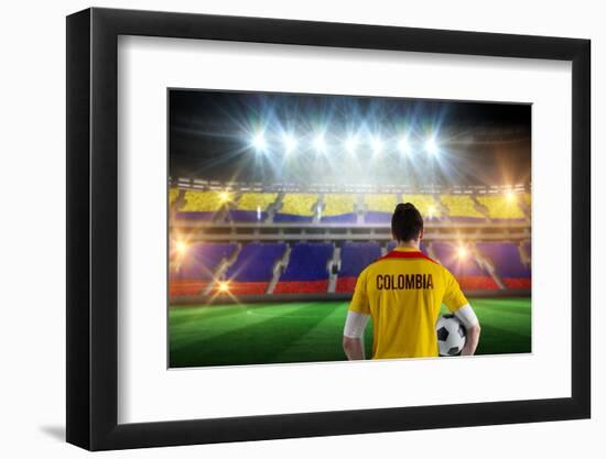 Colombia Football Player Holding Ball against Stadium Full of Colombia Football Fans-Wavebreak Media Ltd-Framed Photographic Print