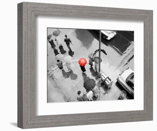 Color Pop,1950s AERIAL OF STREET CORNER IN THE RAIN PEDESTRIANS WITH UMBRELLAS CARS WET PAVEMENT-null-Framed Photographic Print