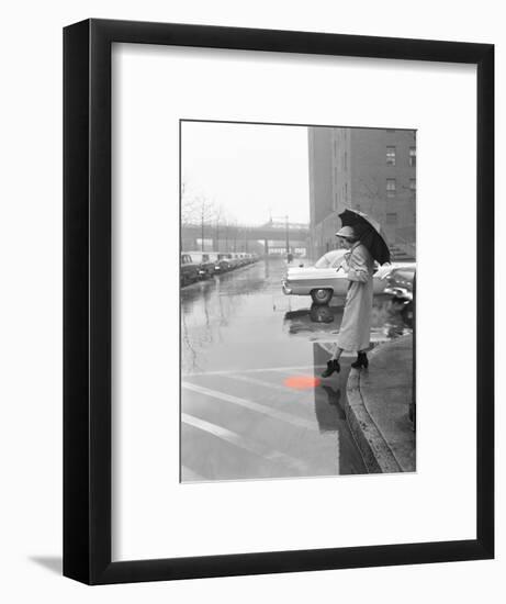 Color Pop,1950s WOMAN IN RAIN COAT HAT BOOTS HOLDING UMBRELLA CROSSING CITY STREET-null-Framed Photographic Print