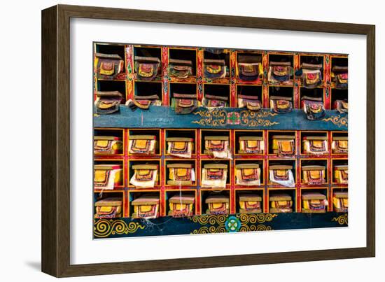 Color wall of books at buddhist monastery in Tengboche, Nepal on the way to Everest Base Camp-David Chang-Framed Photographic Print