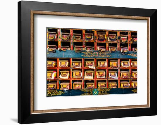 Color wall of books at buddhist monastery in Tengboche, Nepal on the way to Everest Base Camp-David Chang-Framed Photographic Print