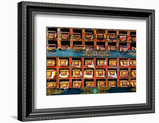 Color wall of books at buddhist monastery in Tengboche, Nepal on the way to Everest Base Camp-David Chang-Framed Photographic Print