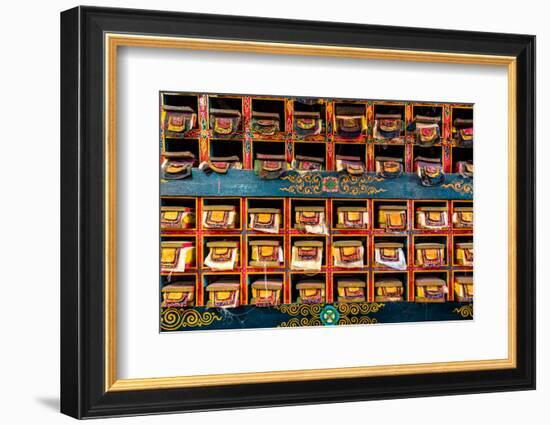 Color wall of books at buddhist monastery in Tengboche, Nepal on the way to Everest Base Camp-David Chang-Framed Photographic Print