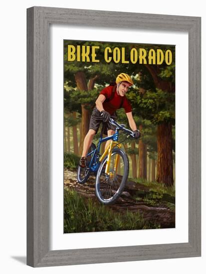 Colorado - Mountain Biker in Trees-Lantern Press-Framed Art Print