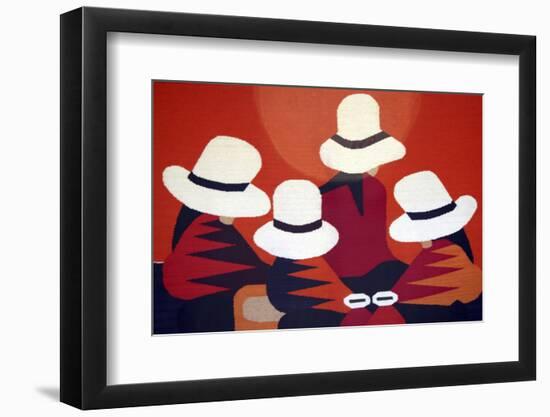 Colorful blanket picturing indigenous women at the market in Otavalo, Ecuador.-Miva Stock-Framed Photographic Print